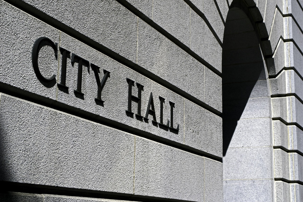 Front of building that says City Hall on it