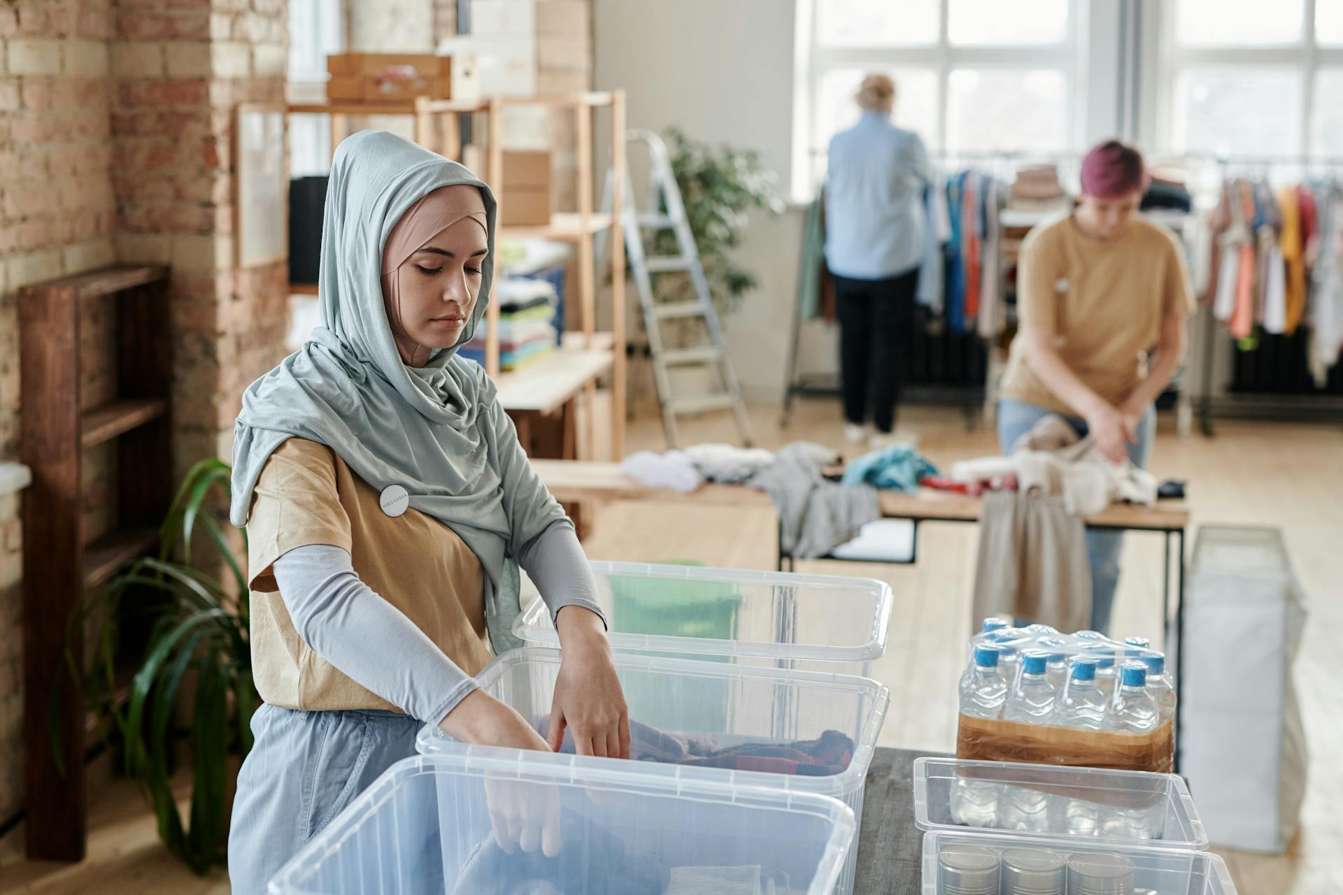 Woman organizing box of supplies