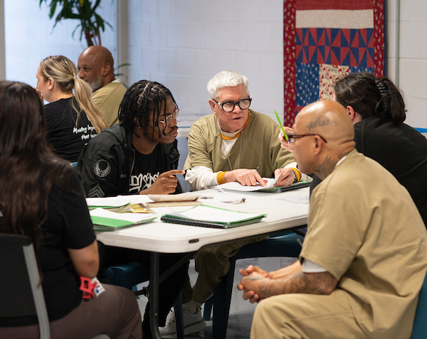 Photo of PAHS students working with incarcerated individuals