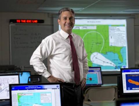 Emergency manager standing in an emergency operations center