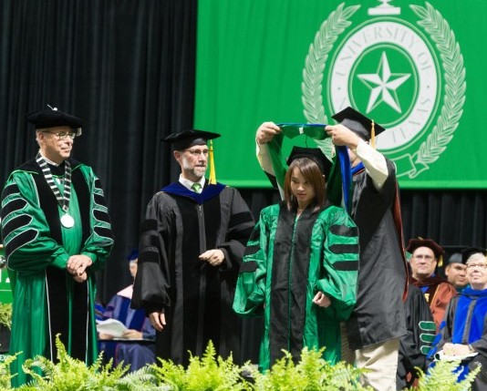 Female Ph.D. student being hooded