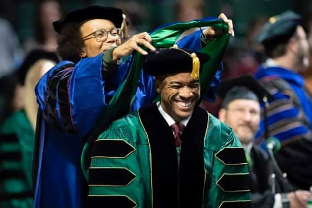 Ph.D graduate student being hooded